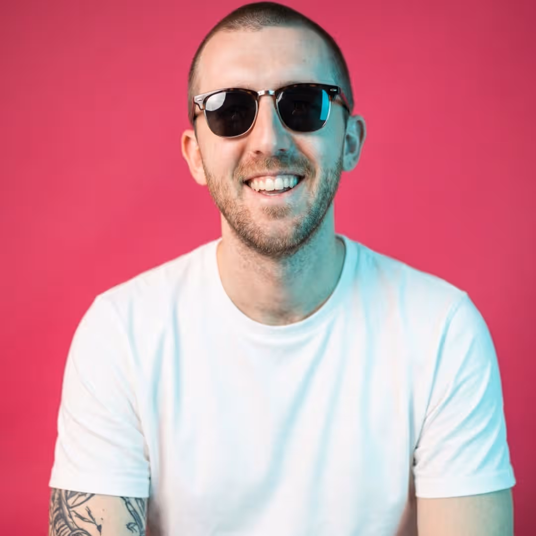 Jack Tear, Salience team member, smiling in sunglasses and light blue shirt