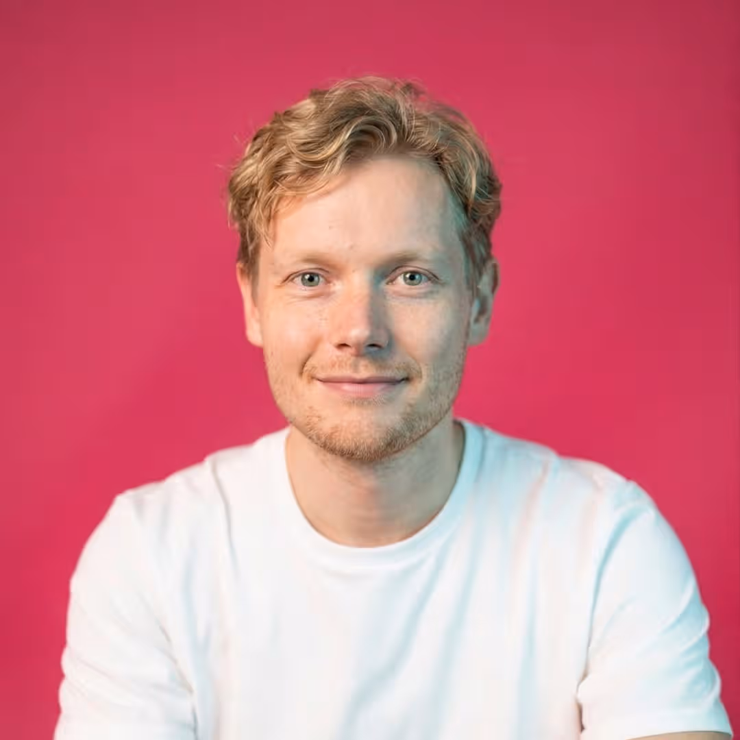 Martyn, Salience search marketing team member, professional headshot on pink background