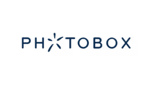 PhotoBox logo with navy lettering and starburst icon design