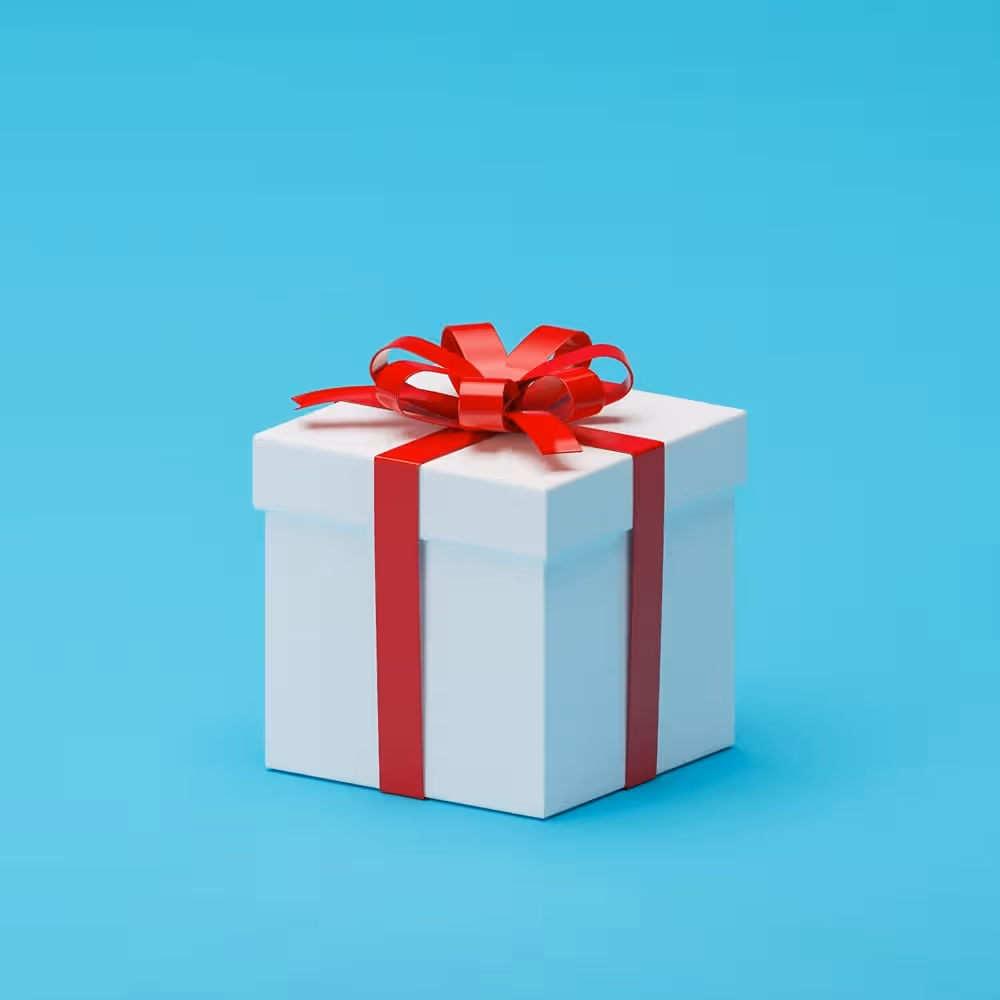 Gift box with red ribbon on blue background, ideal for marketing promotions.